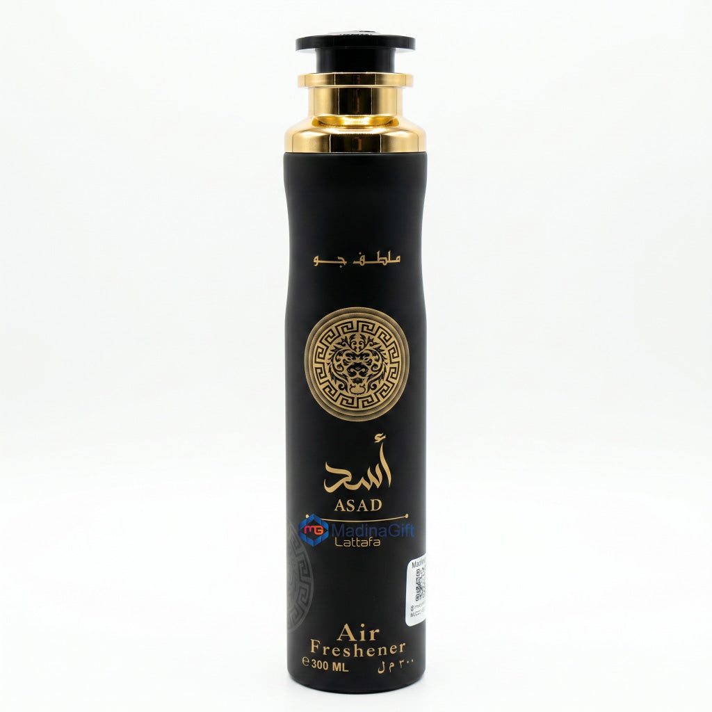 Black air freshener bottle with gold accents on a white background