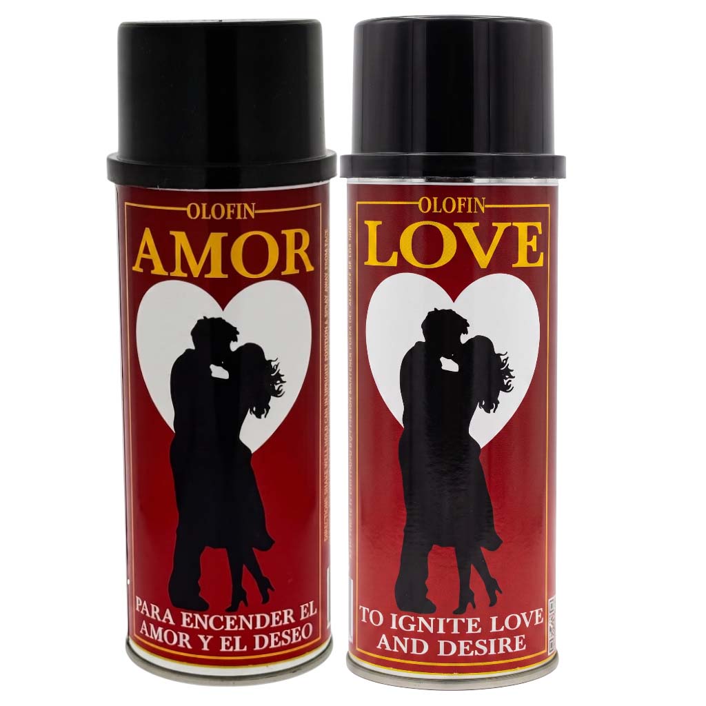 Two aerosol spray cans of Olofin Amor perfume or fragrance, featuring a red label with a black silhouette of a couple, a white heart, and gold and white text.