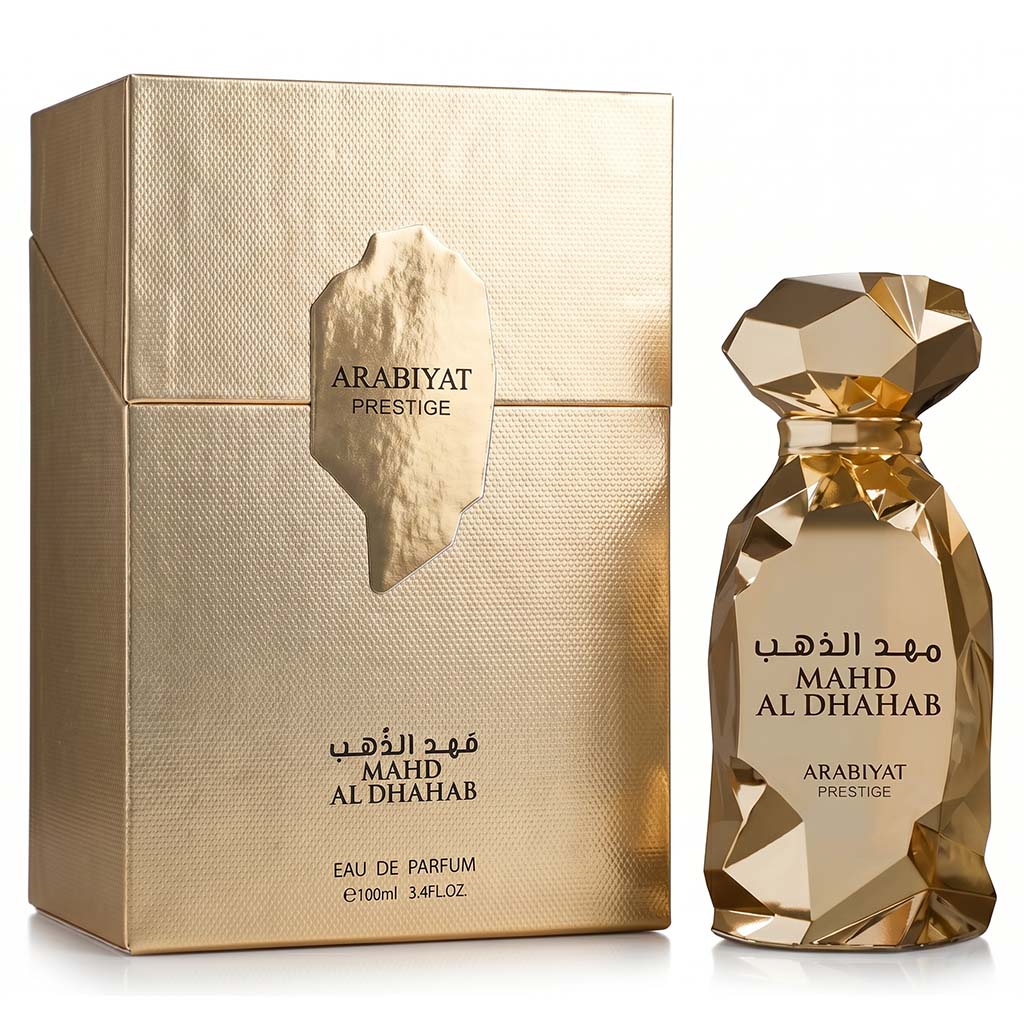 Gold ARABIYAT Prestige perfume bottle and packaging on a white background