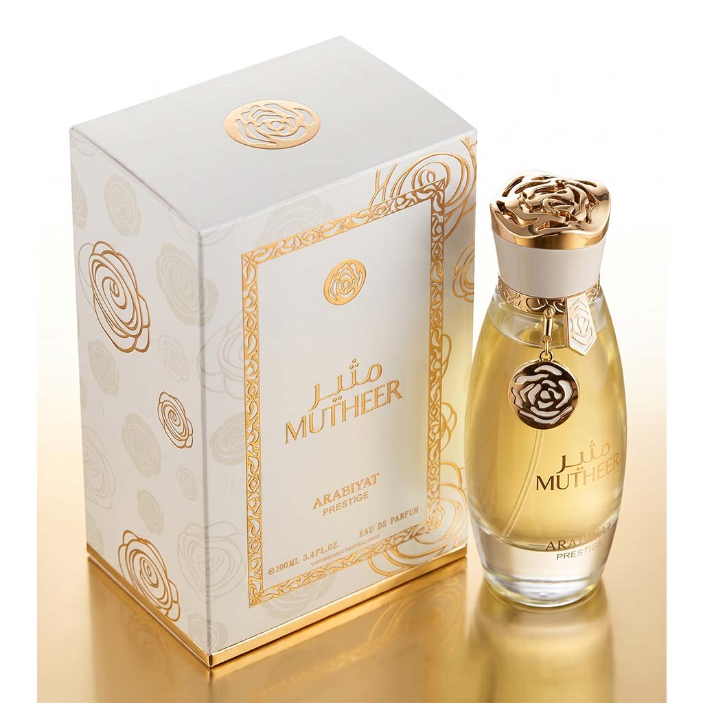 Perfume bottle and packaging of Lila Muthee' on a reflective surface