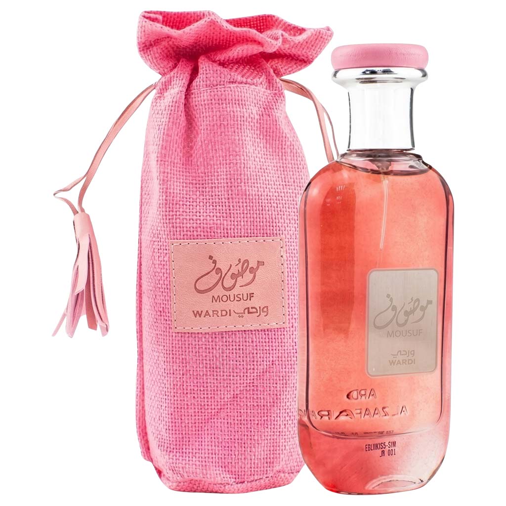 Pink perfume bottle and packaging with a label on a white background