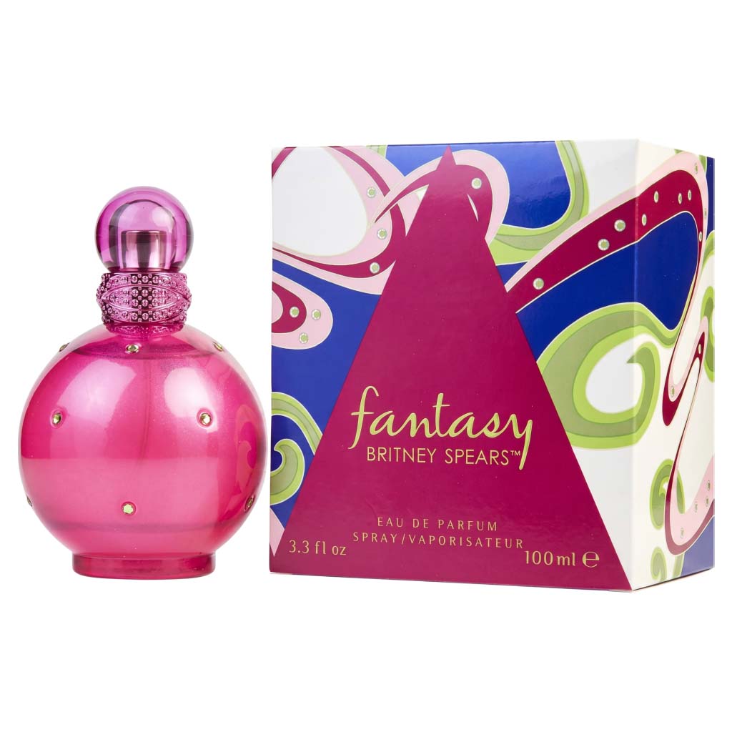 Pink perfume bottle and colorful packaging of Britney Spears' Fantasy on a white background