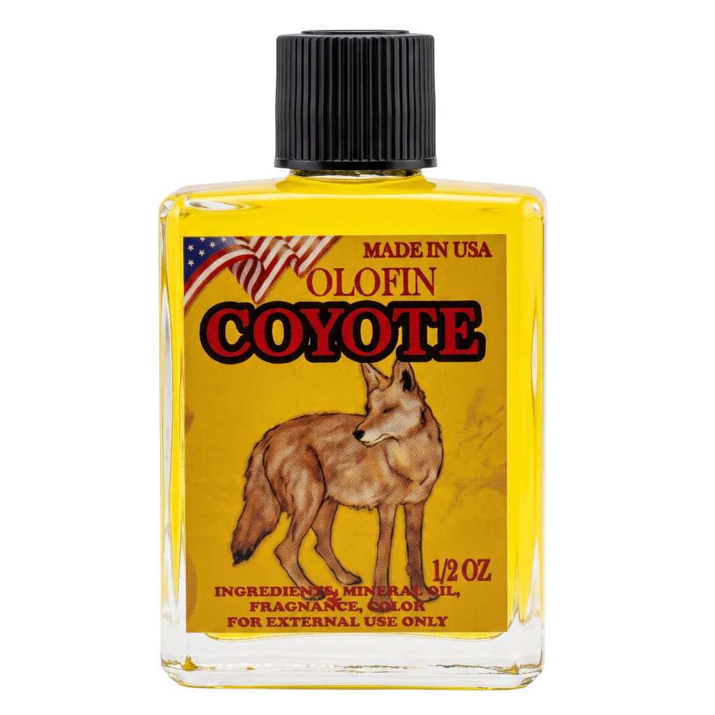 A 1/2 oz glass bottle of Olofin Coyote fragrance oil, filled with yellow liquid and featuring a black ribbed cap. The front label displays a brown coyote illustration on a yellow background with red and black lettering.