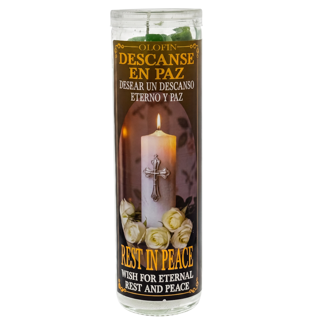A tall glass jar prayer candle with a printed devotional label reading 'O LOVIN DESCANSE EN PAZ' and 'REST IN PEACE.' The label shows a lit white candle with a silver cross, white roses, and a dark brown background.