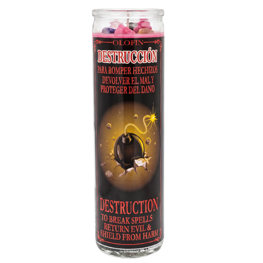 A tall glass jar candle labeled 'Olofin Destrucción' with a black label featuring a bomb illustration and red and white text, shown on a plain white background.