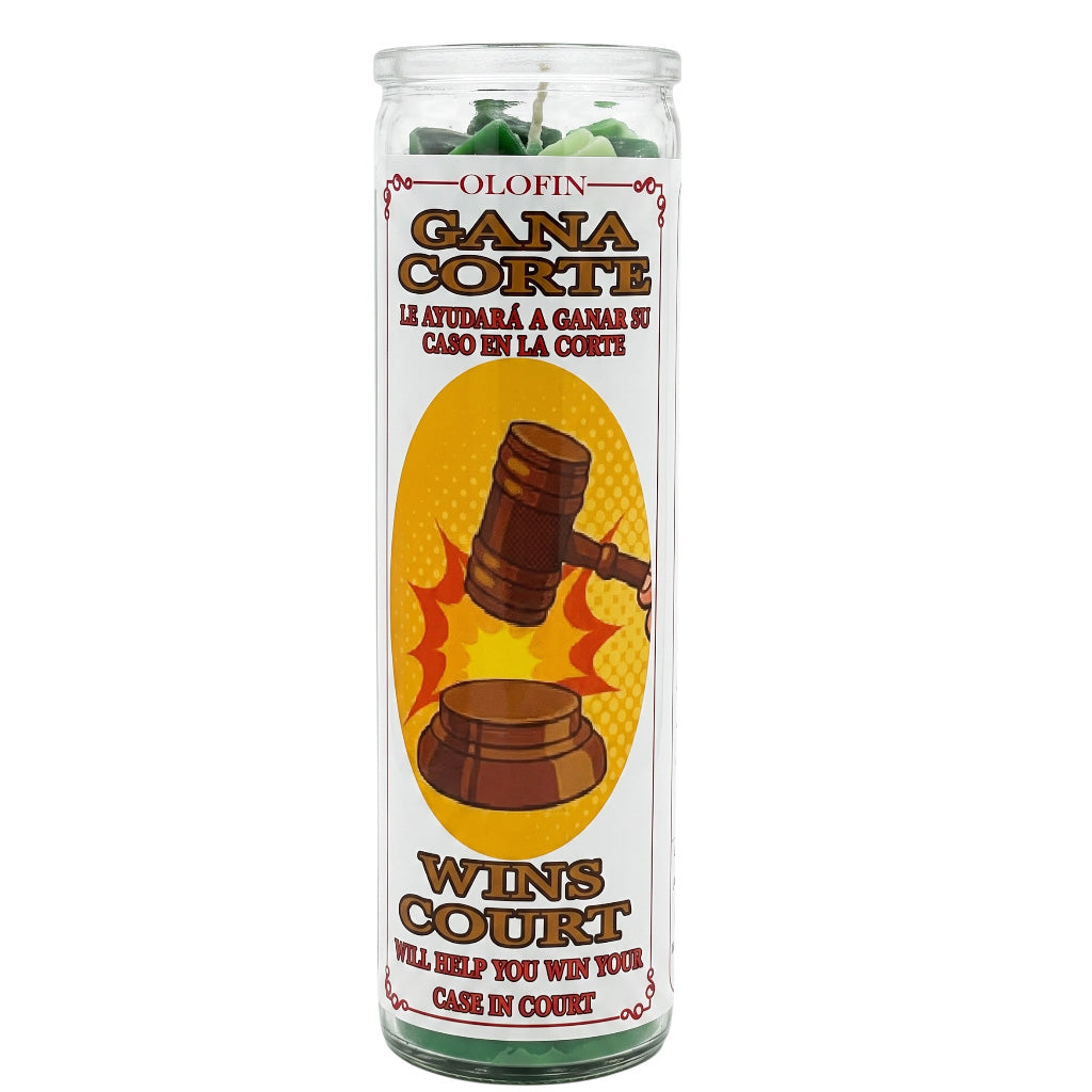 A tall clear glass jar candle with green wax visible at the top and a printed label reading 'Olofin Gana Corte Wins Court' with a gavel graphic, shown on a plain white background.