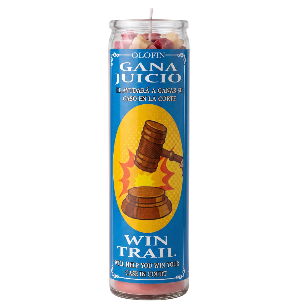 A tall glass jar candle with a blue label reading 'Olofin Gana Juicio' and 'Win Trail', featuring a gavel illustration and pink wax visible at the top and bottom.