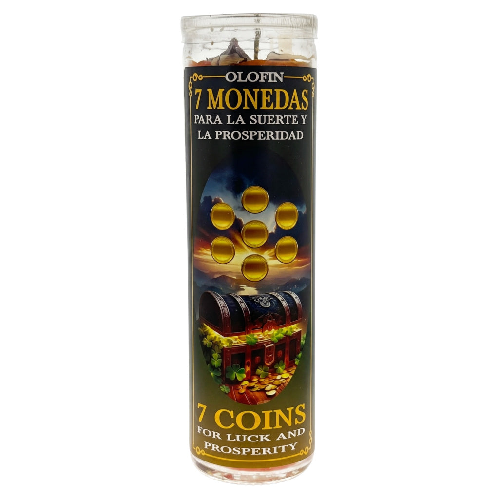 A tall glass jar candle labeled '7 Monedas Para La Suerte Y La Prosperidad' with a dark label featuring gold text, seven gold coin illustrations, and an image of a treasure chest over gold coins.