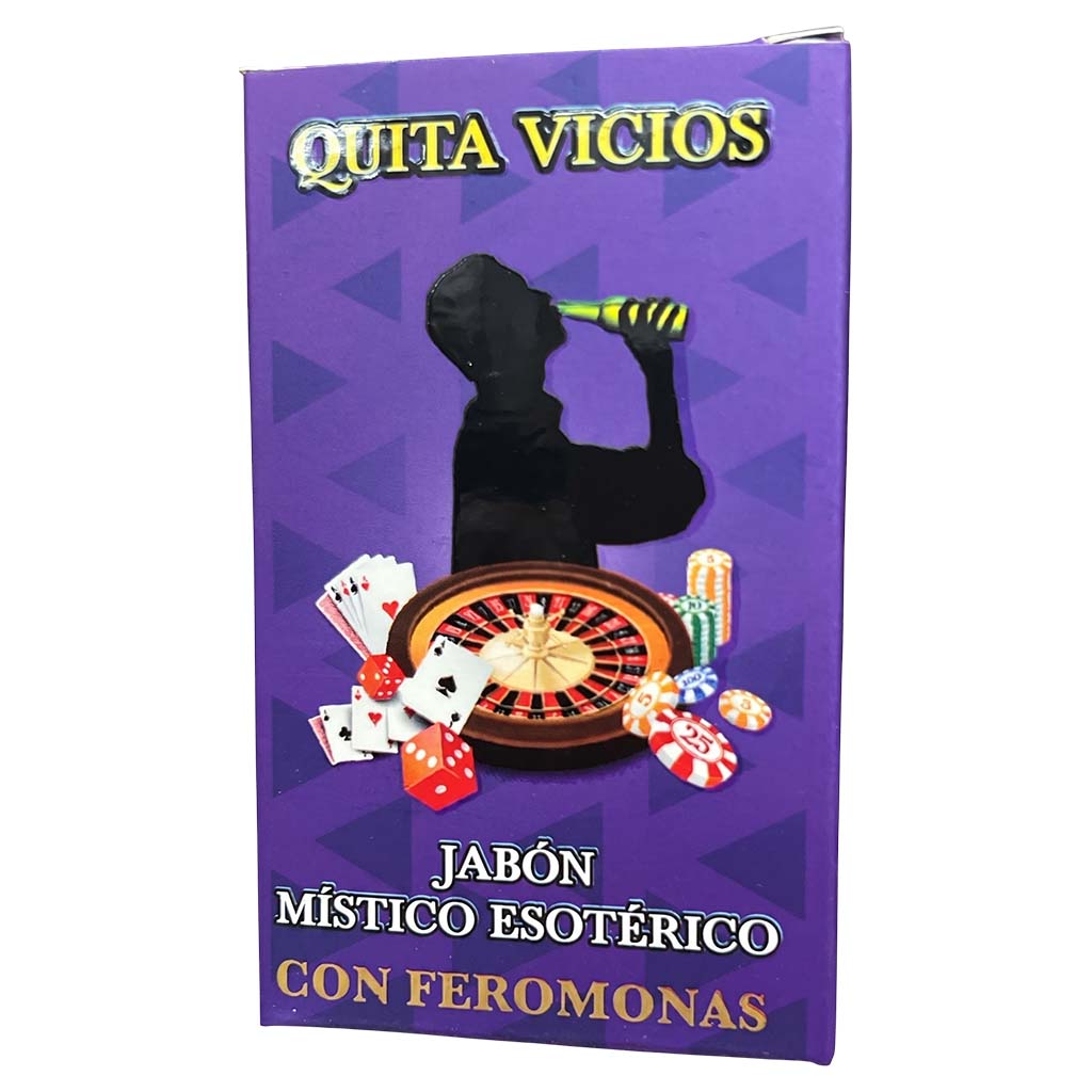 A purple rectangular product box with Spanish text reading 'QUITA VICIOS', 'JABÓN MÍSTICO ESOTÉRICO', and 'CON FEROMONAS'. The front shows a black silhouette of a person holding a bottle above a roulette wheel, cards, dice, and chips on a purple background with darker triangular shapes.