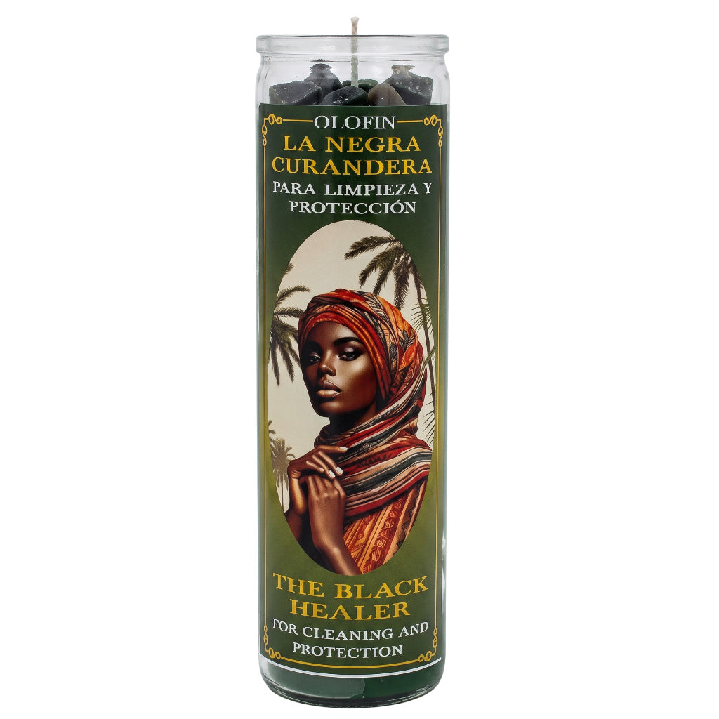 A tall glass jar candle labeled 'Olofin La Negra Curandera' with a printed illustration of a woman in a headwrap on a dark olive label, shown on a plain white background.
