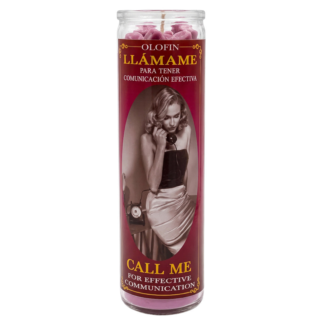 A tall glass prayer candle with a dark red label featuring a vintage-style portrait of a woman and Spanish text reading 'Olofin Llámame Para Tener Comunicación Efectiva' and 'Call Me For Effective Communication.' Pink wax is visible at the top inside the clear glass container.