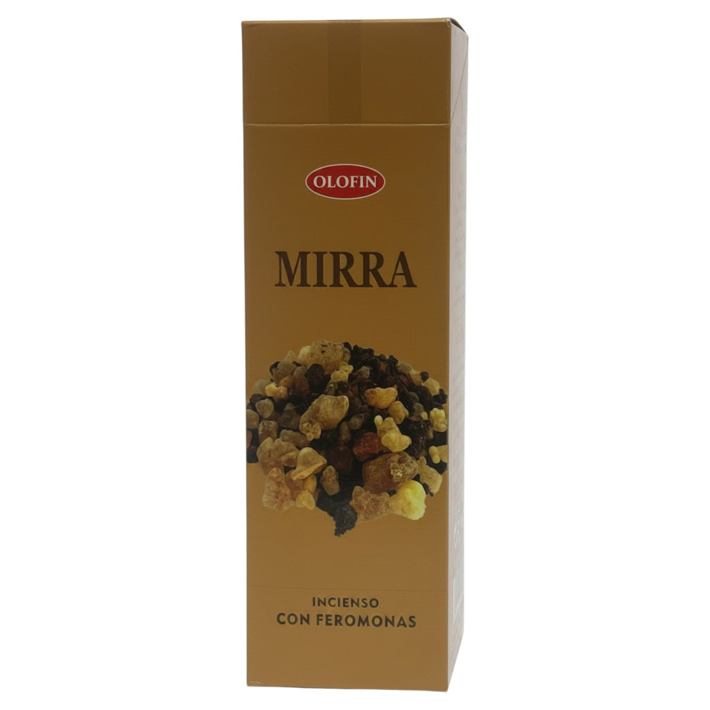 A tall rectangular Olofin Mirra incense box with a metallic gold finish, featuring a photo of dried incense herbs and the text 'MIRRA' and 'INCIENSO CON FEROMONAS' on a white background.