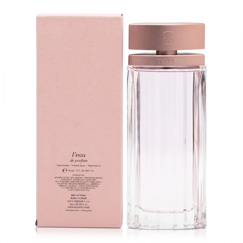 Perfume bottle with rose gold cap and packaging on a white background
