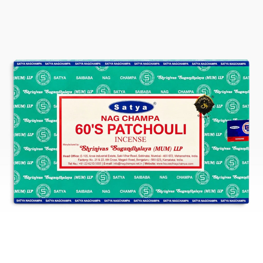 A rectangular box of Satya Nag Champa 60's Patchouli incense, featuring a teal and blue patterned background with a large white and red central label.
