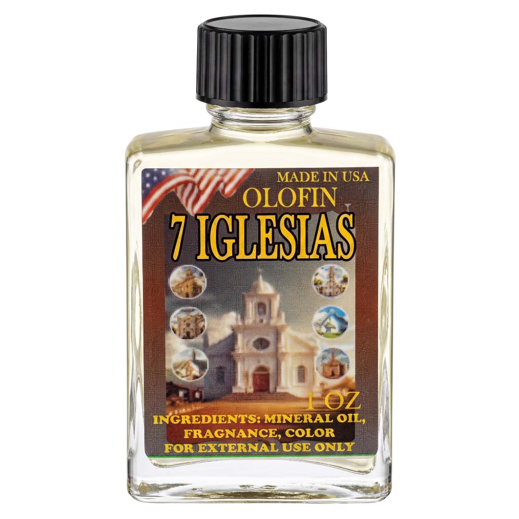A 1 oz bottle of Olofin 7 Iglesias mineral oil fragrance, featuring a clear glass bottle with a black ribbed cap and a detailed label depicting a church and an American flag.