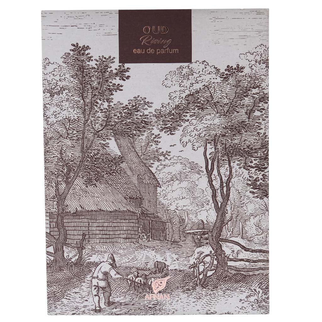 A rectangular perfume box with a vintage-style engraved illustration of a rural landscape, featuring trees, a thatched cottage, and a shepherd with sheep. The top has a dark brown label reading 'Oud Riezing eau de parfum' and a small pink heart logo near the bottom center.