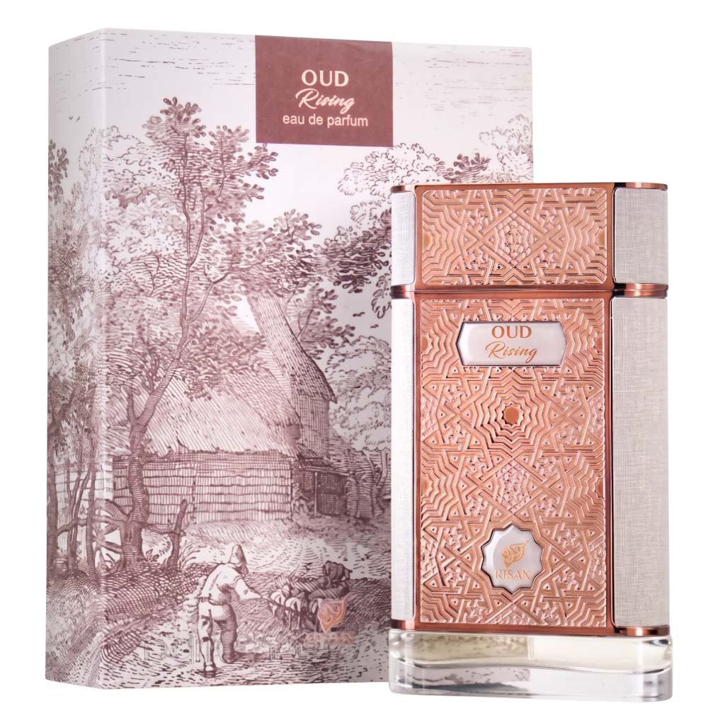 Oud Rising Eau de Parfum bottle with its matching illustrated packaging box, featuring a rose gold patterned front, textured silver sides, and a sepia-toned rural landscape illustration.