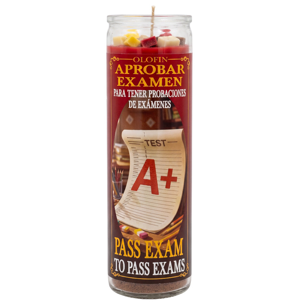 A tall glass jar candle with a Spanish label reading 'O Lofin Aprobar Examen' and 'Pass Exam to Pass Exams,' featuring an A+ test paper graphic on a red and brown label.