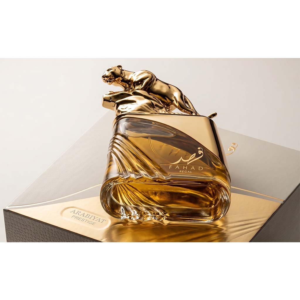 Gold and glass perfume bottle with panther design on a white background