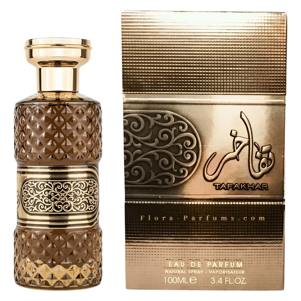 Decorative perfume bottle and packaging with intricate designs on a white background