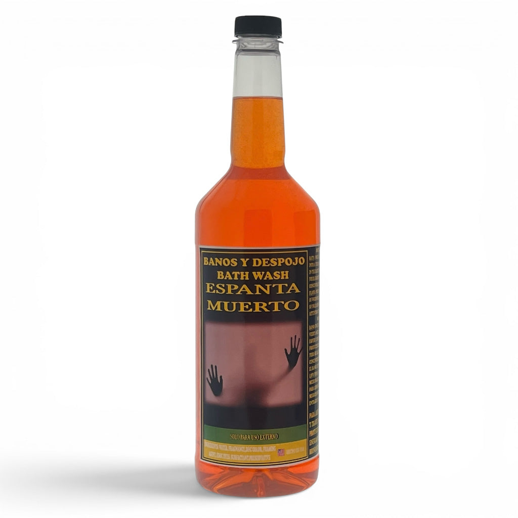 A bottle of Espanta Muerto bath wash with orange liquid, featuring a black cap and a label with Spanish text and a dark image of hands reaching up, set against a plain white background.