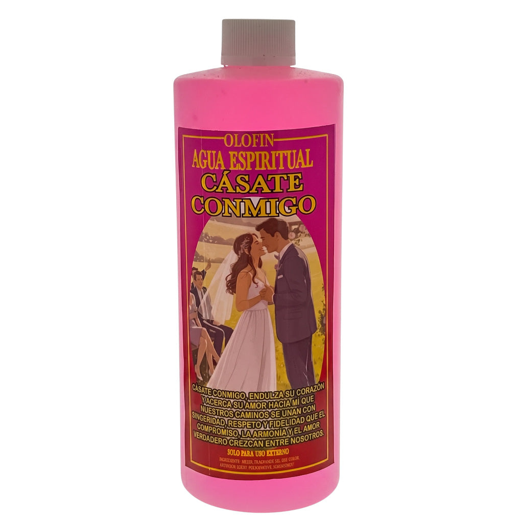 A pink plastic bottle of Olofin Agua Espiritual Casate Conmigo, featuring a vintage-style label with a couple embracing and yellow text, set against a plain white background.