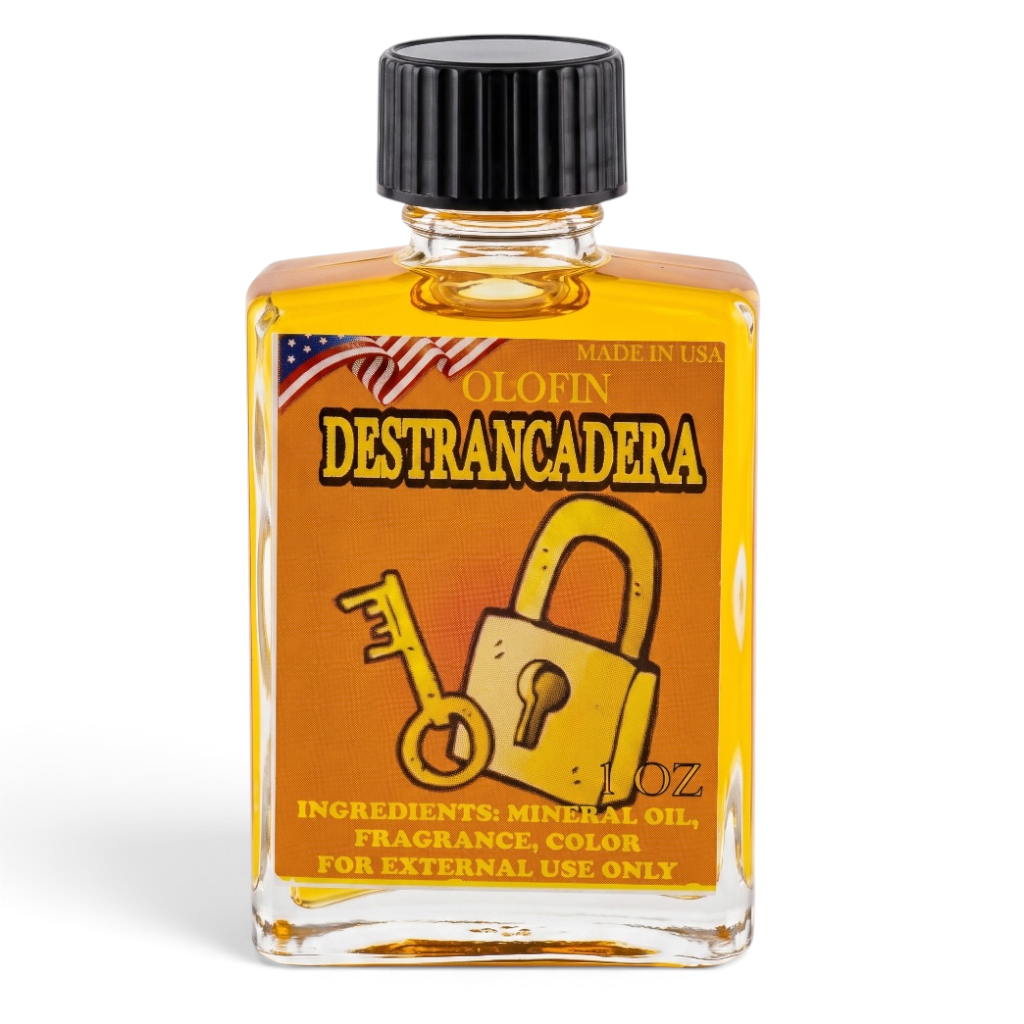 A 1 oz clear glass bottle of Olofin Destrancadera fragrance oil with a black ribbed cap, filled with amber-colored oil and featuring a yellow and orange label with a padlock and key graphic.