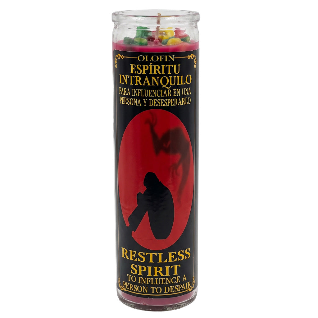 A tall glass jar candle labeled 'Olofin Espíritu Intranquilo / Restless Spirit' with a black label, red oval graphic, and multicolored wax pieces visible at the top, shown on a plain white background.