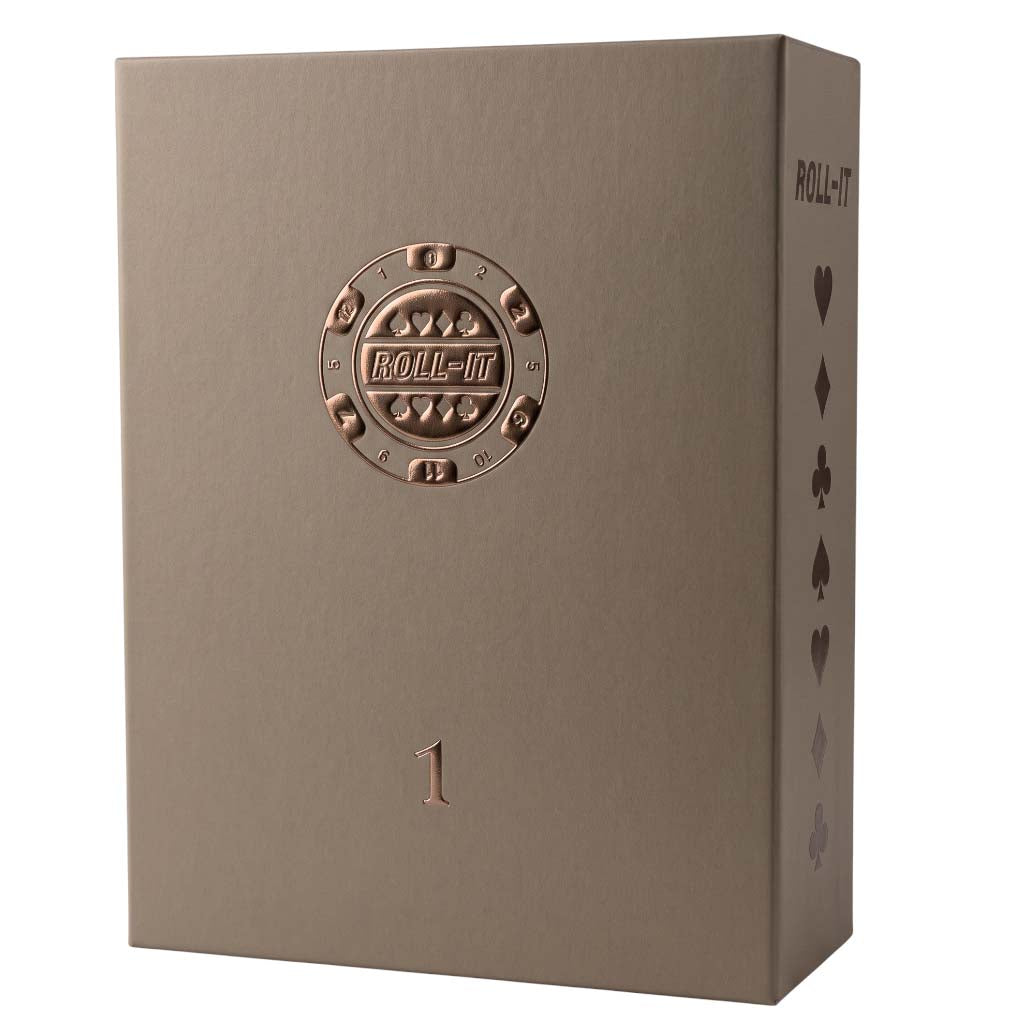 A rectangular roll-it playing card deck box in a warm taupe-brown color, featuring embossed rose-gold metallic details including a circular emblem on the front, a card number '1' near the bottom, and playing card suit icons on the side.