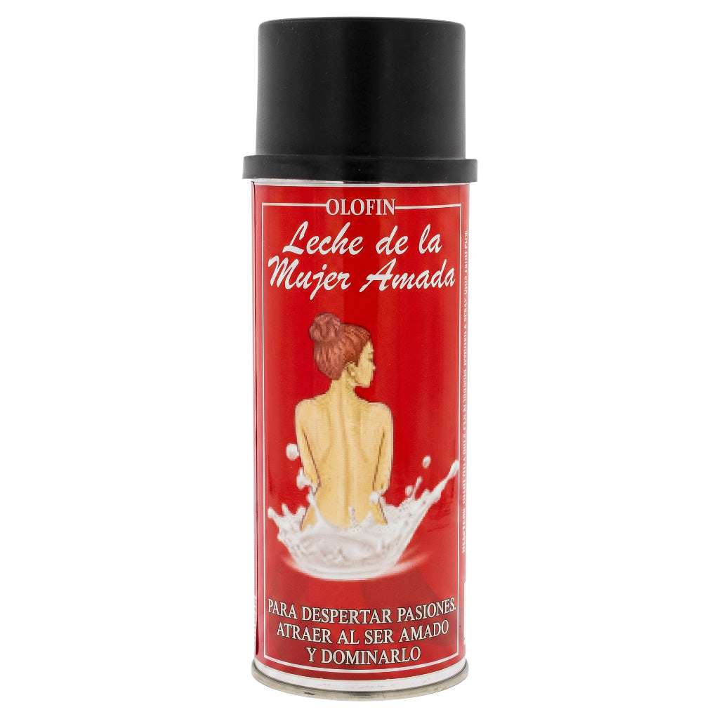 A can of Olofin 'Leche de la Mujer Amada' on a plain white background. The product is a red aerosol can with a black cap, featuring a label with a woman's back and a splash of white milk.