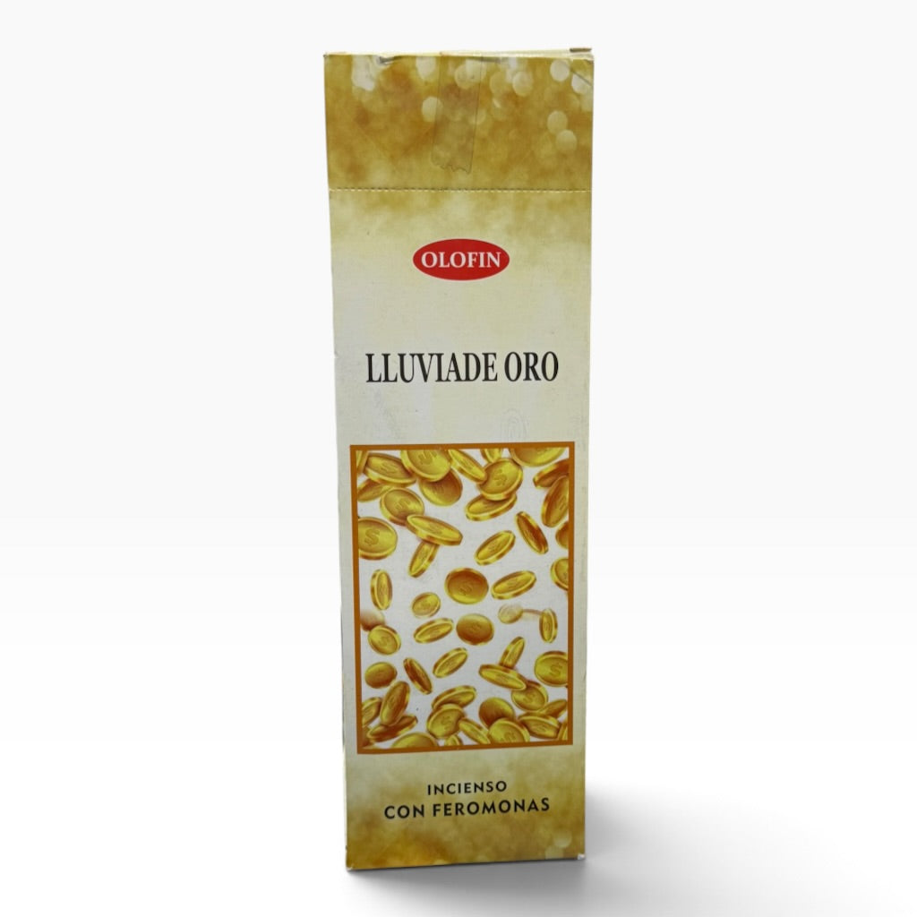 A tall rectangular Olofin 'LLUVIADE ORO' incense packet with a cream and gold design, featuring an illustration of gold-colored discs and Spanish text at the bottom, set against a plain white background.