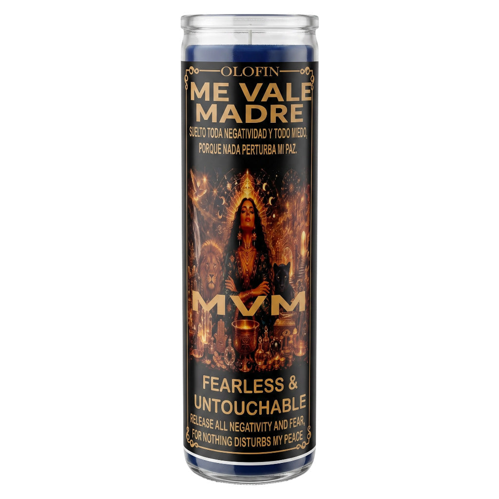 A tall glass prayer candle with a dark label reading 'Olofin Me Vale Madre' and 'Fearless & Untouchable,' featuring a fiery religious illustration and the text 'MVM' in large gold letters, shown on a plain white background.