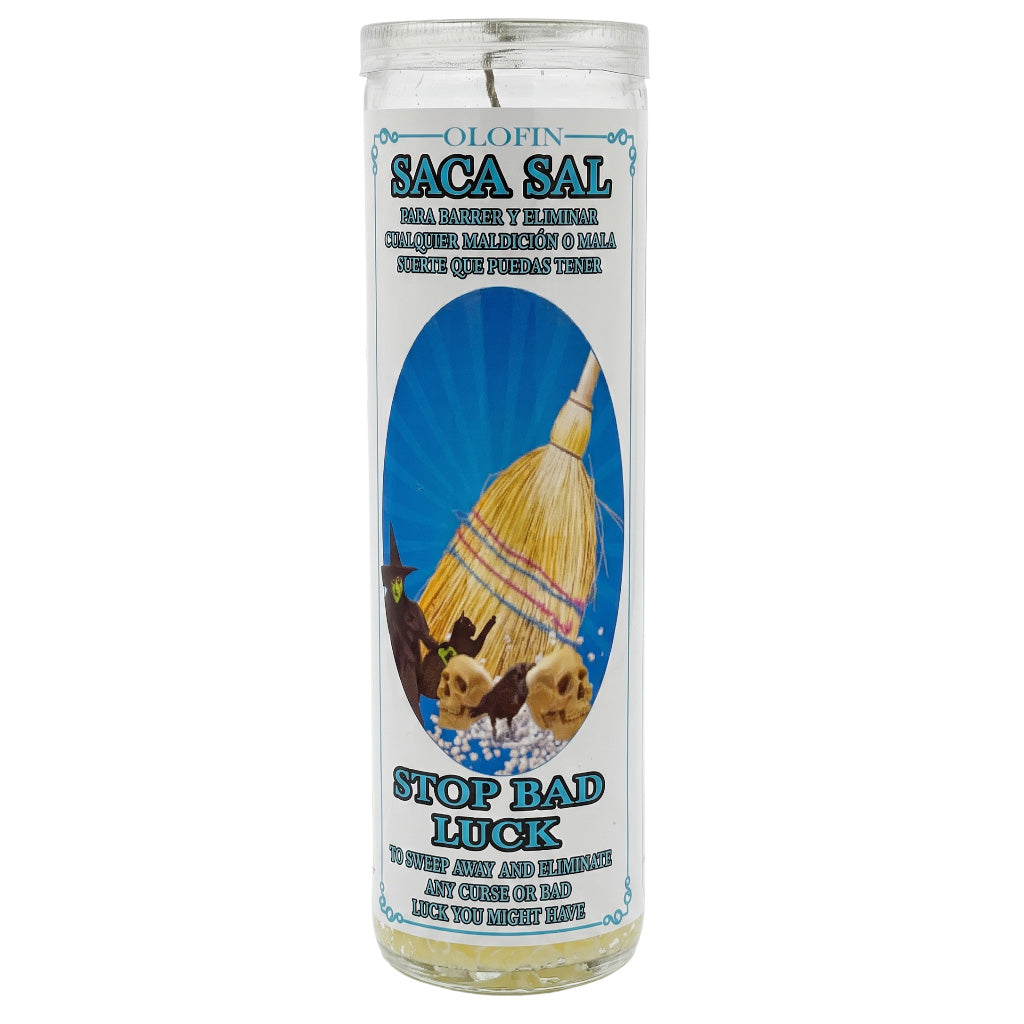 A tall clear glass prayer candle with a white label featuring the brand 'Olofin' and product name 'Saca Sal'. The label has a blue sunburst background with an illustration of a yellow and red thatched hut, alongside the text 'Stop Bad Luck'.