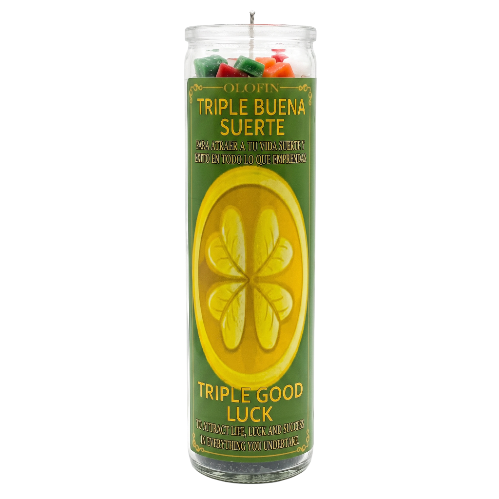 A tall glass jar candle labeled 'OLOFIN TRIPLE BUENA SUERTE / TRIPLE GOOD LUCK' with a green and yellow label and multicolored wax pieces visible at the top, shown on a plain white background.